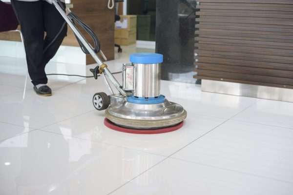 cleaning floor with machine.